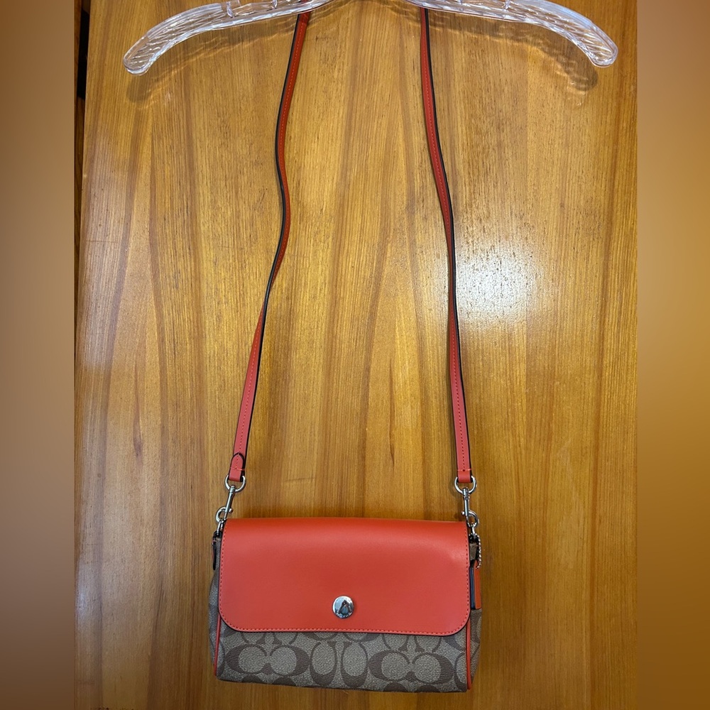 Orange leather and coach pattern crossbody